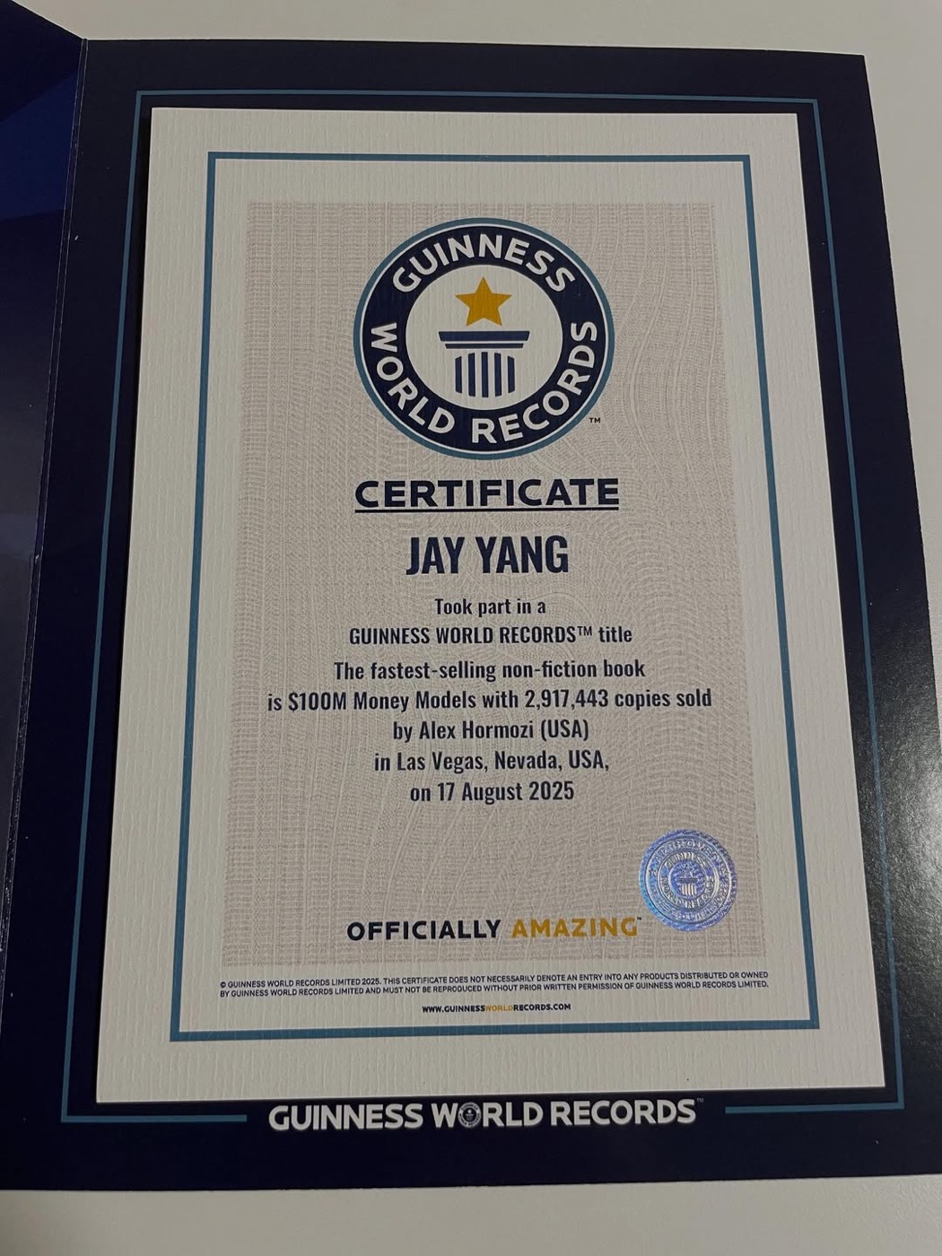Guinness World Records certificate awarded to Jay Yang for taking part in the fastest-selling non-fiction book record.